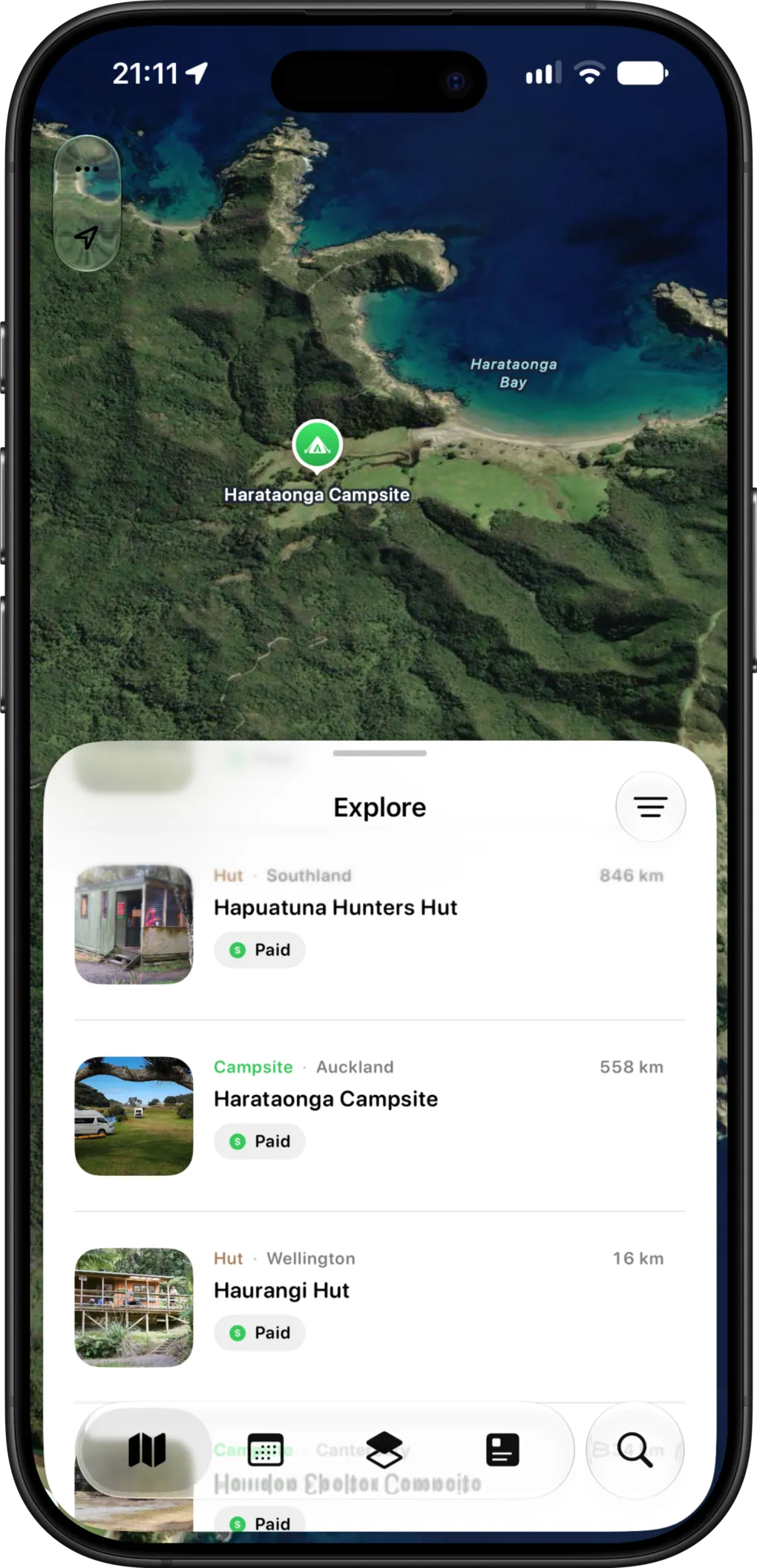 The KiwiCamping Explore list showing DOC huts and campsites in Southland, Auckland and Wellington with their distance from the map view